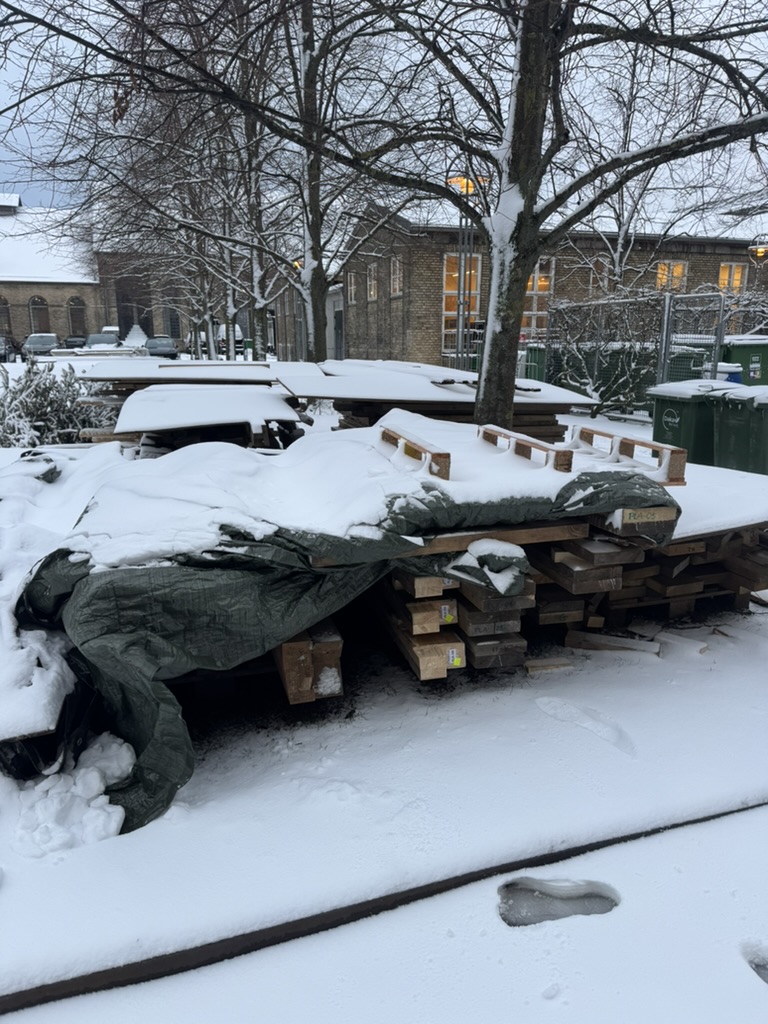 stack of timber in the snow